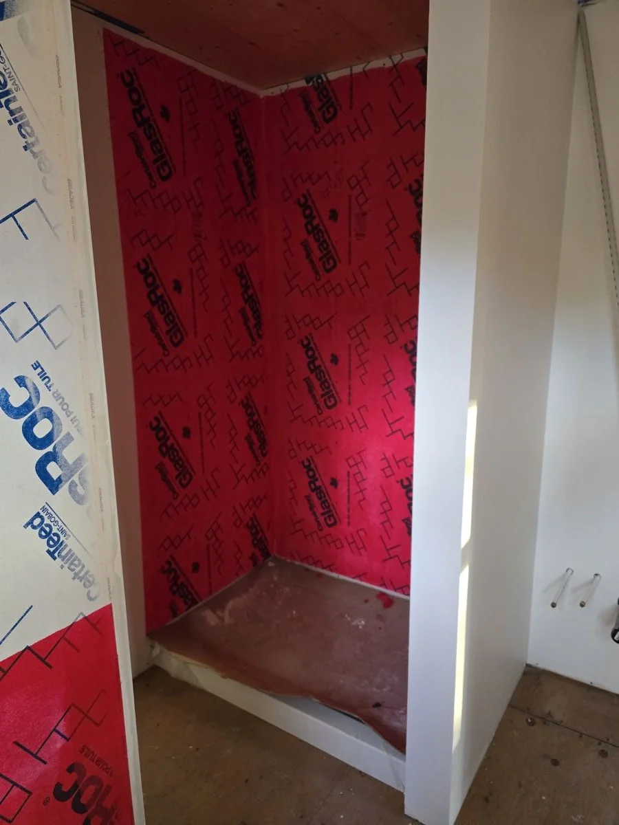 Shower alcove framed and vapour sealed before board and tile