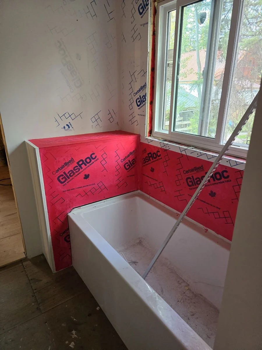 Bathroom rough-in complete with tub installed and walls sealed