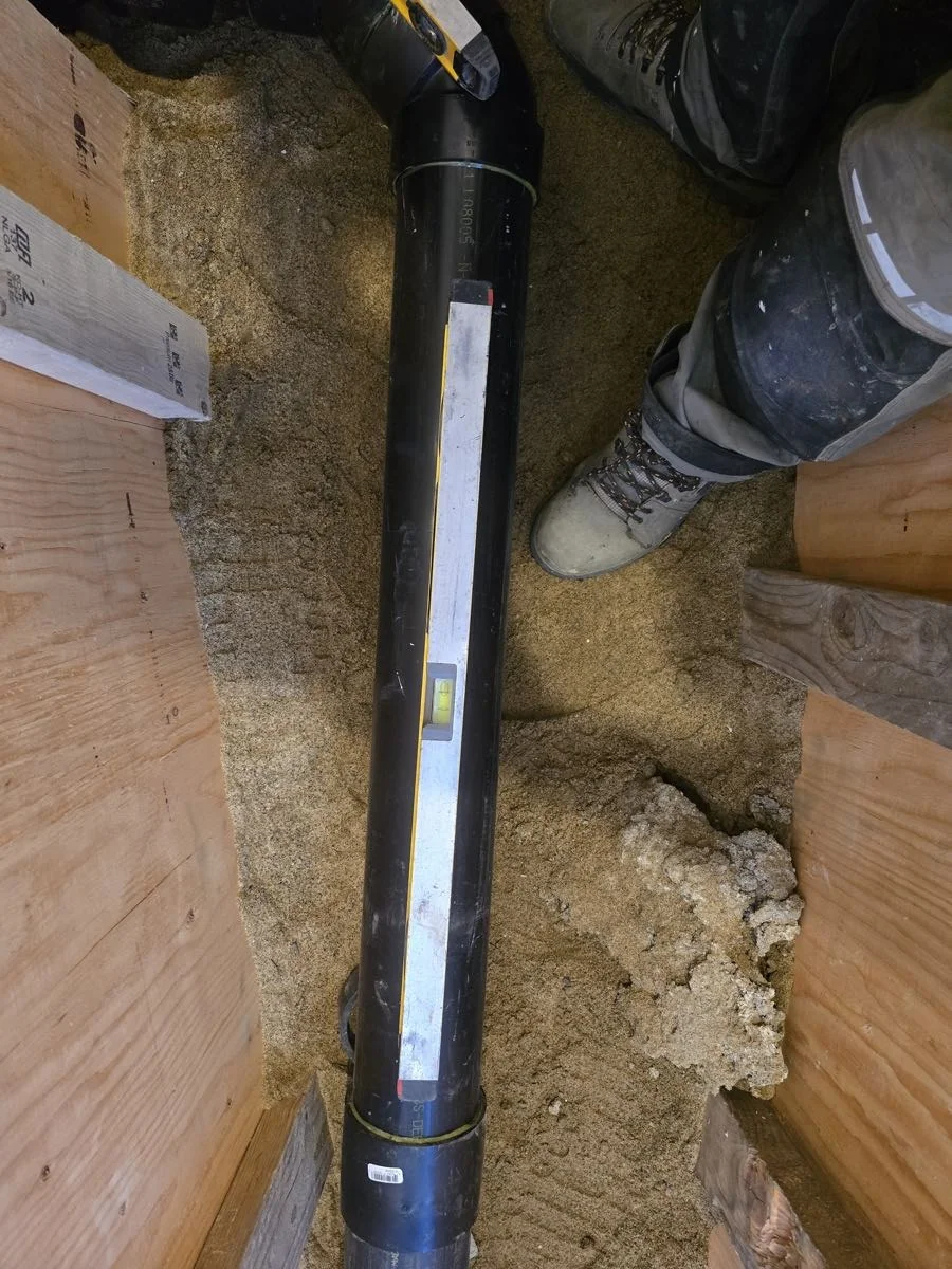ABS drain stack run vertically through a crawlspace