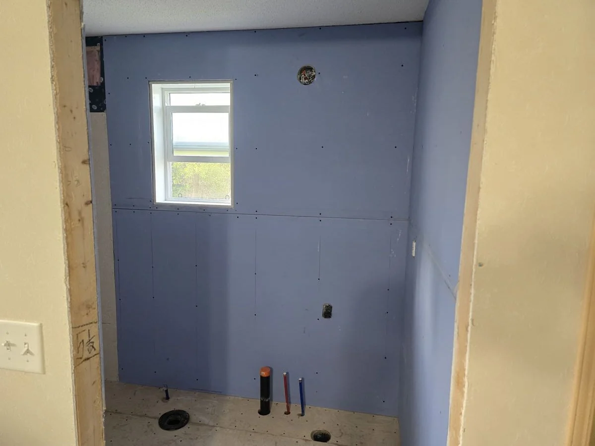 Bathroom boarded and prepared for tile during a renovation