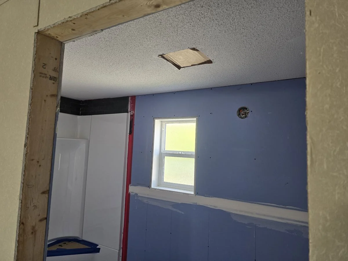 Bathroom renovation in progress with board and framing complete