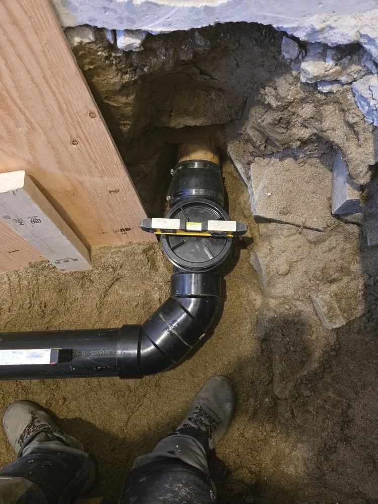 New drain line installed and levelled beneath a home in Chase, BC